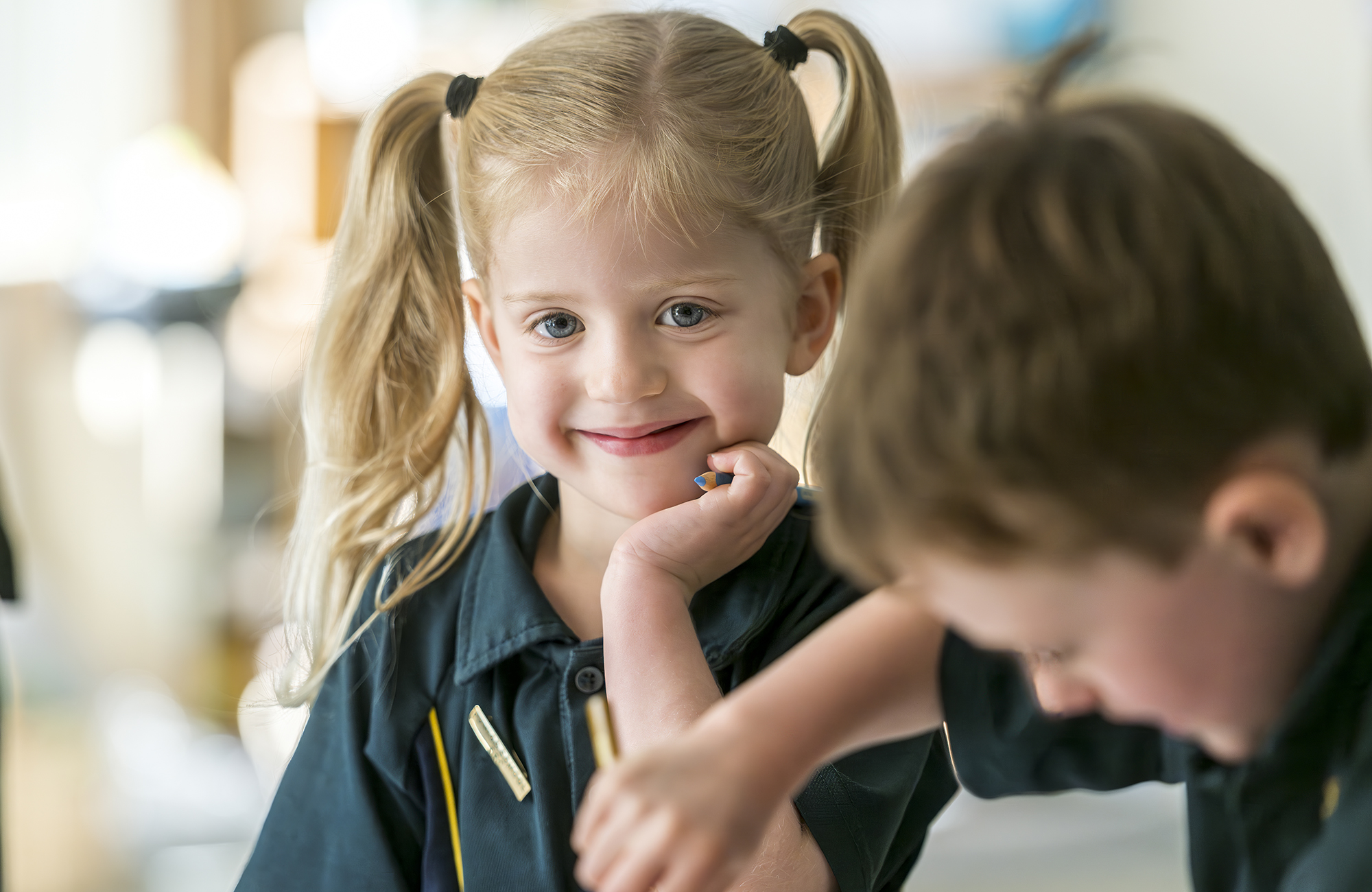Young Mercedes College student smiling during classroom activities